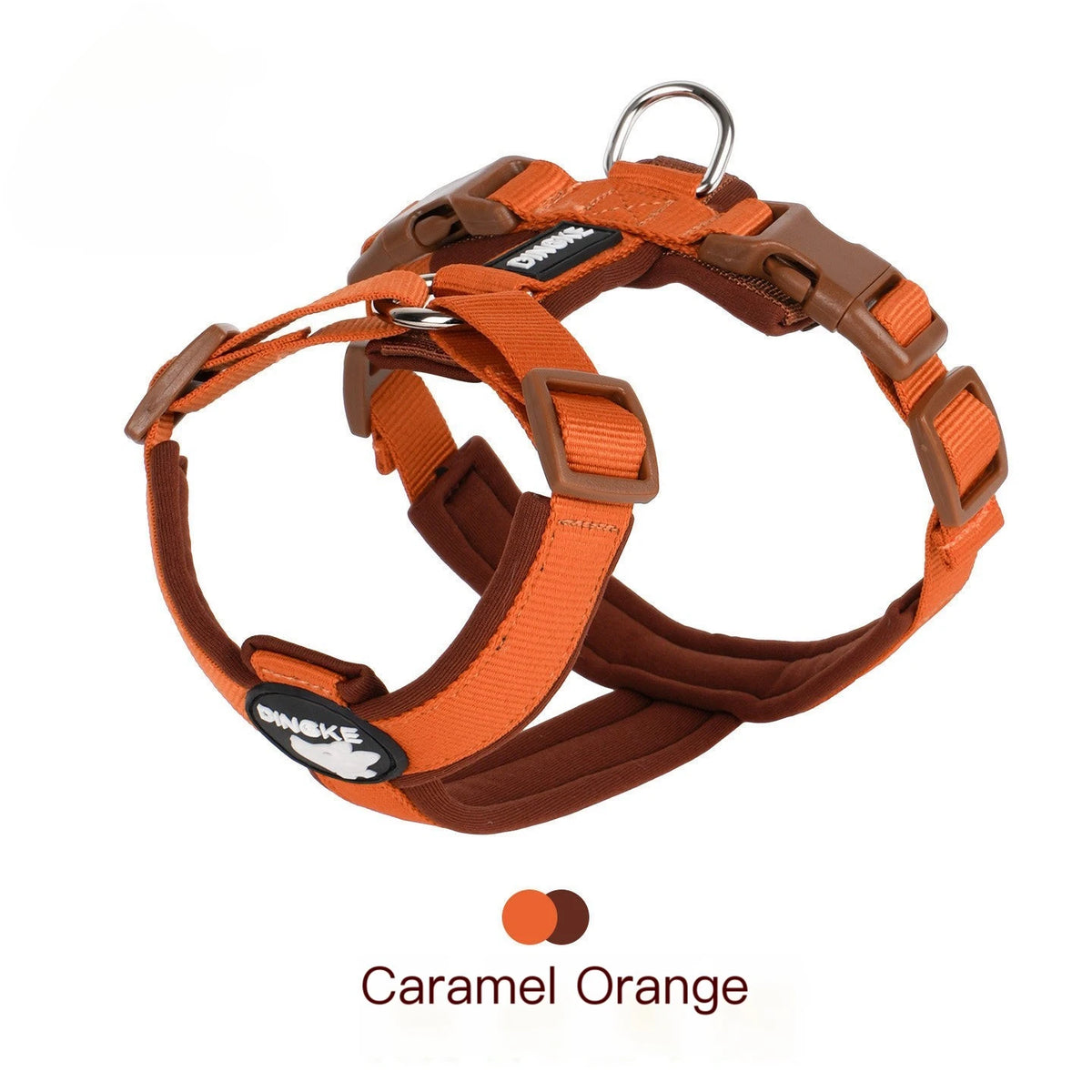 A brown dog harness with orange reflective strips is shown against a white background.