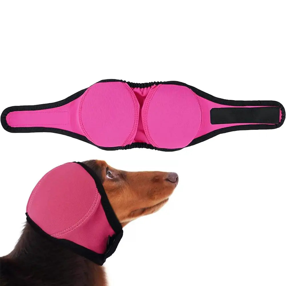Pink noise cancelling dog ear wrap placed next to a brown dog's head.