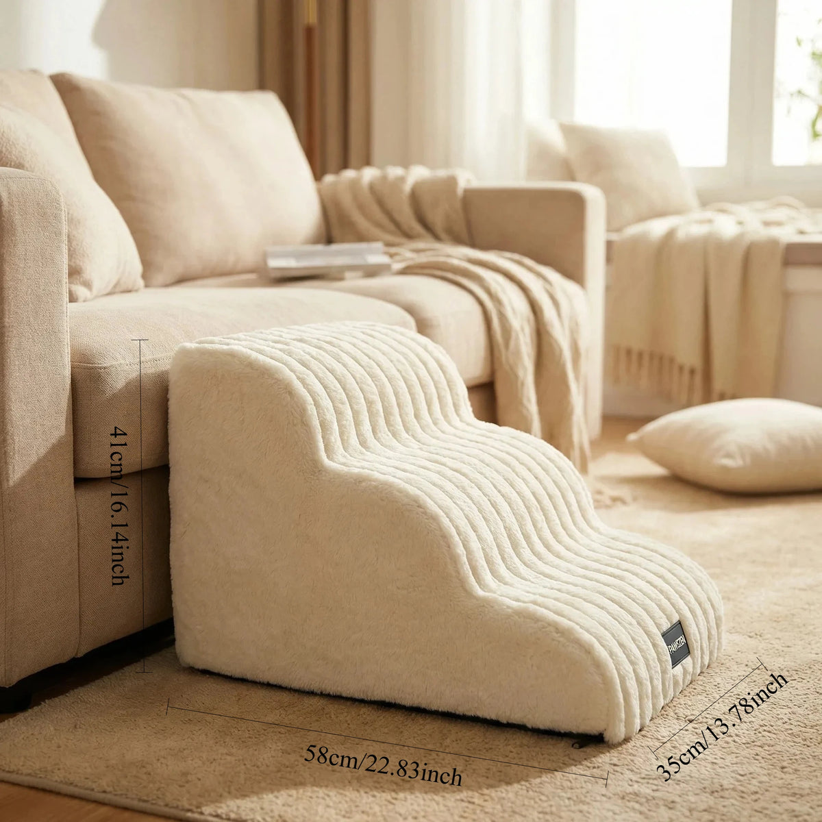 A beige pet safety climbing stairs product resting on a light carpet in a bright living room setting.