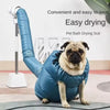 A pug dog is wearing a blue pet bath drying suit while hanging on a drying rack.
