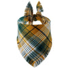 A plaid dog bandana featuring shades of olive green, mustard yellow, and beige with fringed edges.