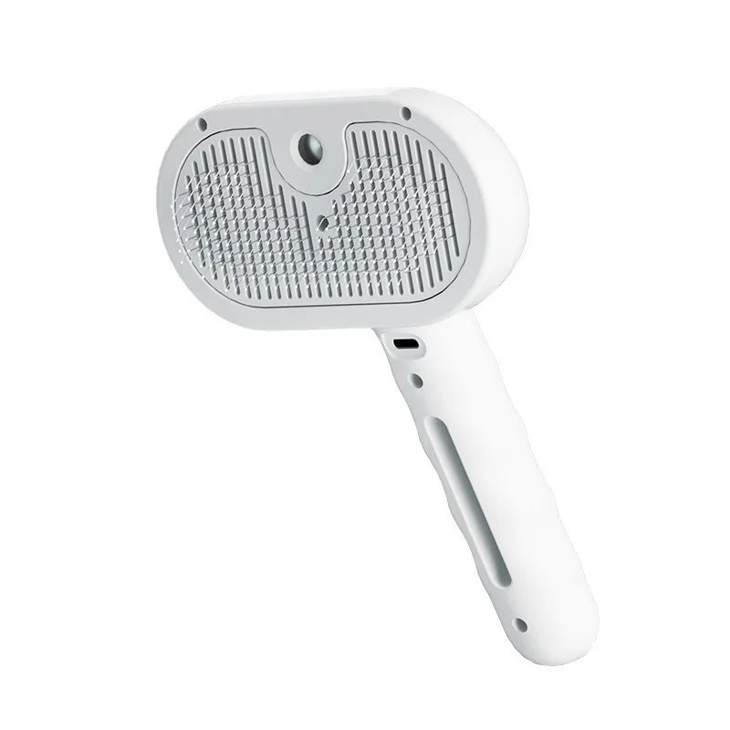 A white dual function dog grooming comb and massage brush with a textured head and handle.
