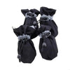 A pair of black cozy anti-slip dog booties with reflective grip