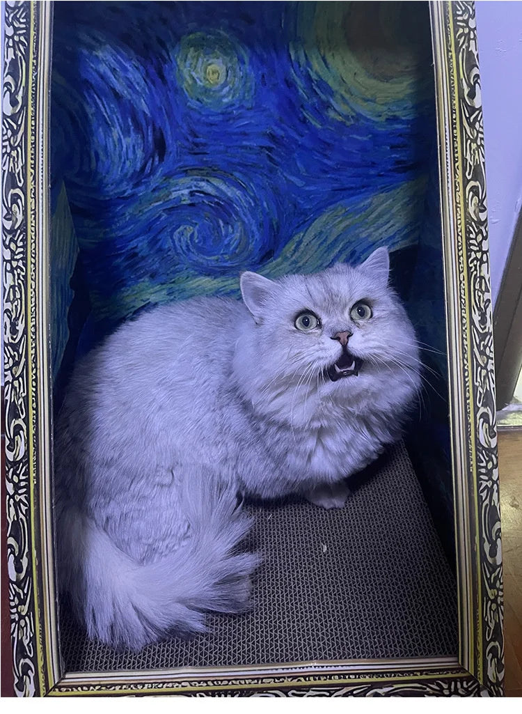 A fluffy gray cat is resting inside a decorative bed with a blue and green swirling pattern.