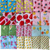 A collection of colorful cotton pet bandanas featuring various fruit and floral patterns for dogs and cats.