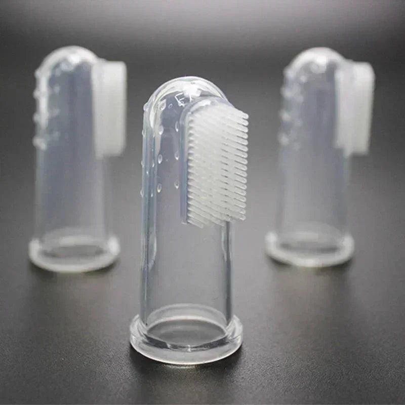 Clear silicone finger toothbrush for dogs with bristles shown in a row
