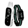 A white remote dog training collar with a black control unit and a green patterned strap.