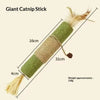 A long, cylindrical catnip stick with a green textured body and a fluffy golden tassel.