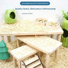 A wooden hamster climbing platform with a natural straw surface is shown on a light wood table.