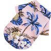 Pink Hawaiian style pet dog summer beach shirt featuring blue and gold tropical floral patterns