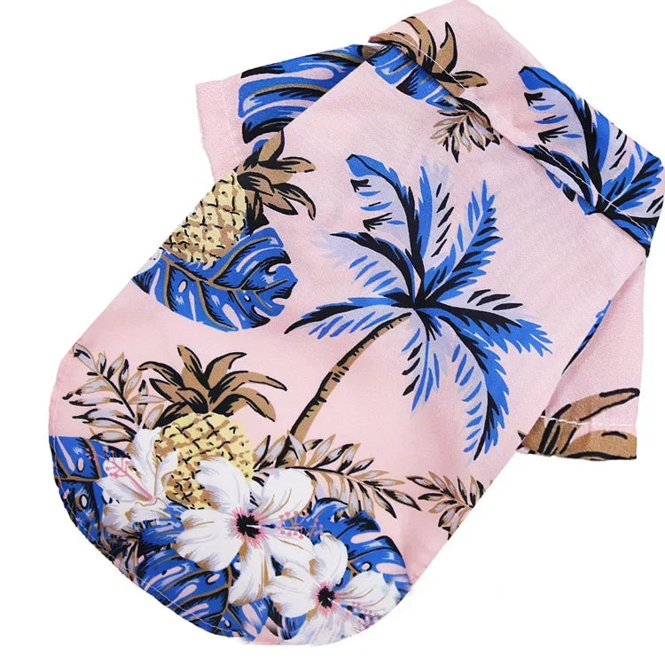 Pink Hawaiian style pet dog summer beach shirt featuring blue and gold tropical floral patterns