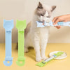 A hand is feeding a white cat with a long-handled pet food dispensing spoon, showing different colored spoons.