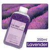 A purple glass bottle of Lavender cat litter deodorizing beads with a lavender field background.
