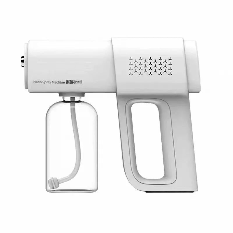 A white electric nano spray machine with a clear bottle and a handle is shown.