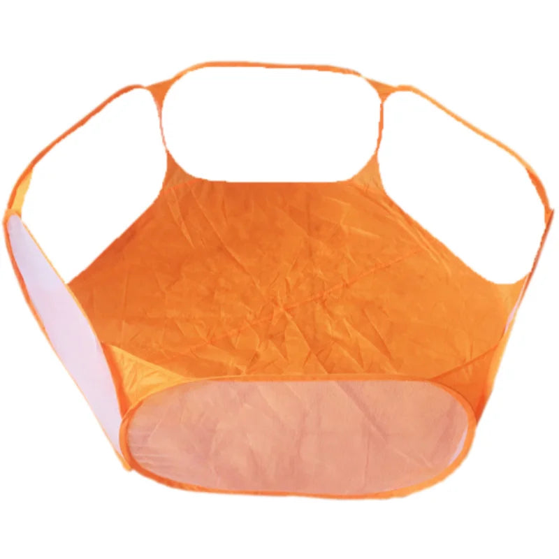 An orange portable pet playpen for small animals with a rounded, flexible design.
