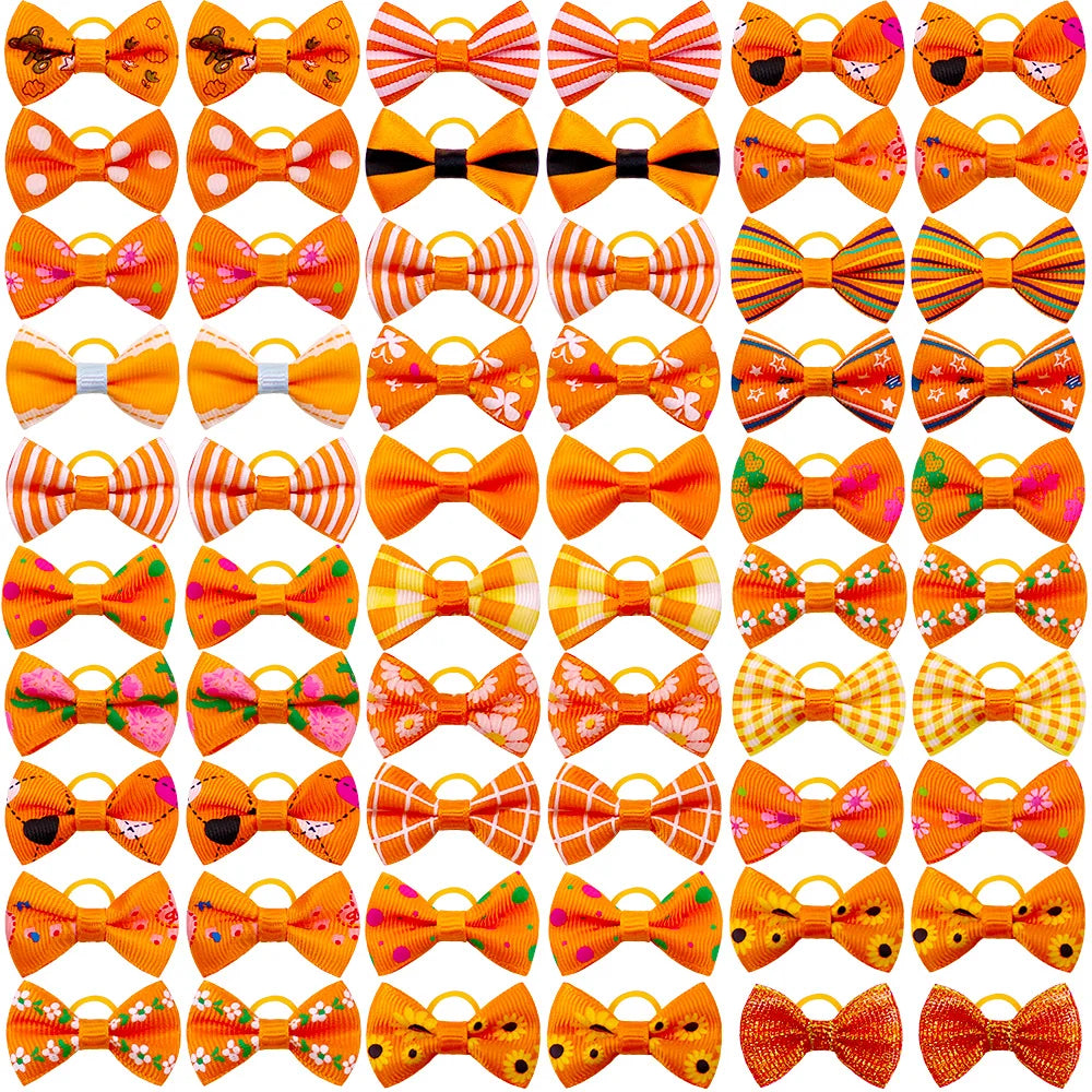 A collection of adorable pet hair bows in various colors and patterns tied with gentle rubber bands.
