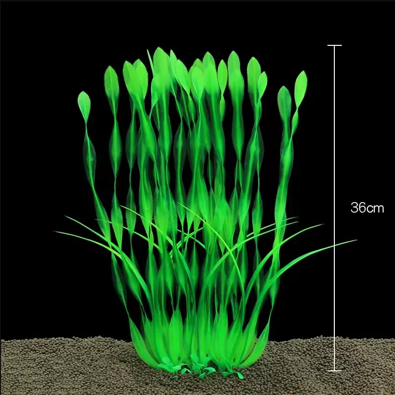 A clump of bright green artificial aquarium plants growing in sand.
