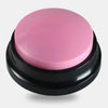 A round, pink talking pet training button with a black base.