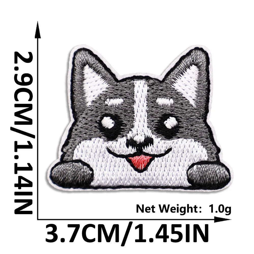 A black and white cat embroidered patch featuring a smiling expression.
