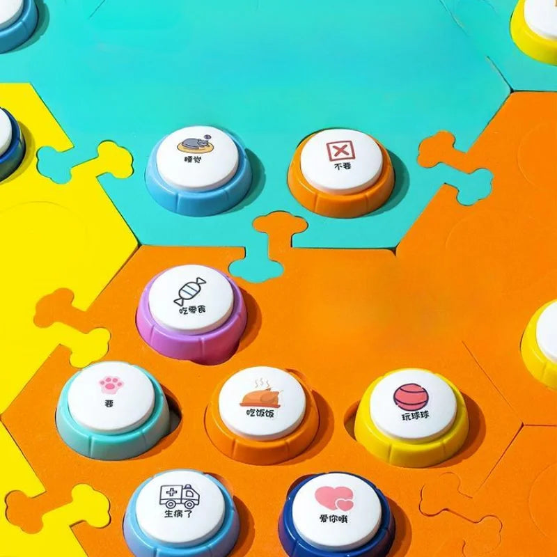 A close-up view of colorful recordable pet training buttons for dog and cat communication, featuring various colored buttons 