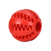 A bright red rubber ball with sharp spikes used as an interactive treat-dispensing toy for dogs.