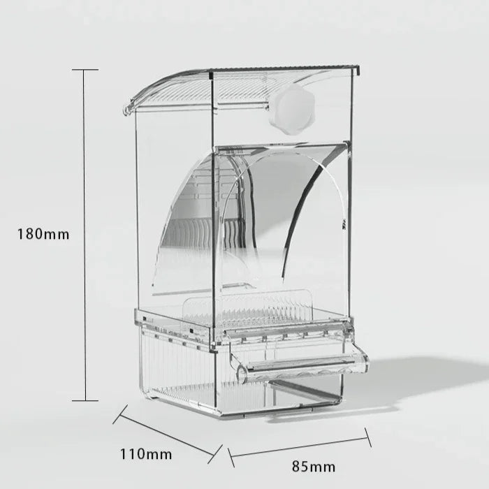 A clear automatic parrot feeder with a separate husk compartment shown in a side view.