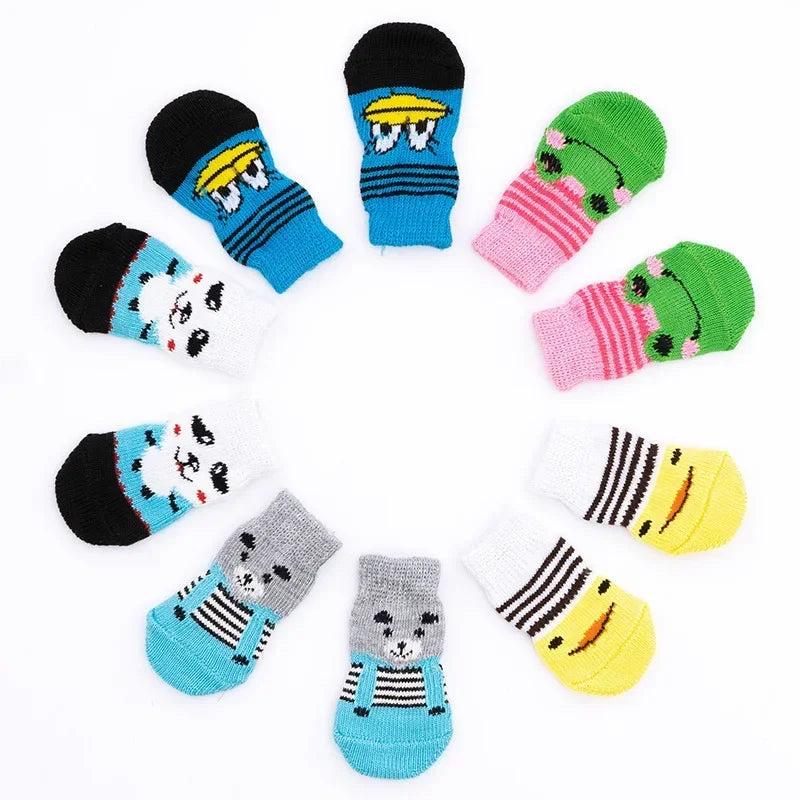 A collection of cute pet dog and cat shoes in various colors and patterns arranged in a circle.