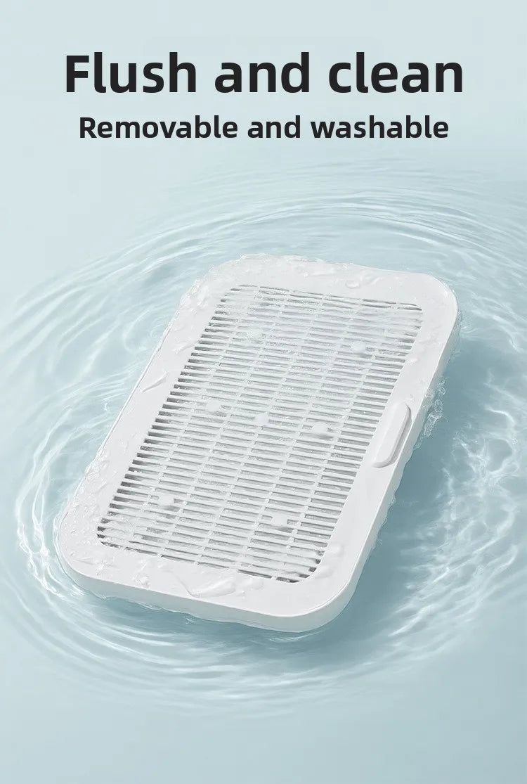 A white dual-layer cat litter mat is shown being flushed and cleaned in water.