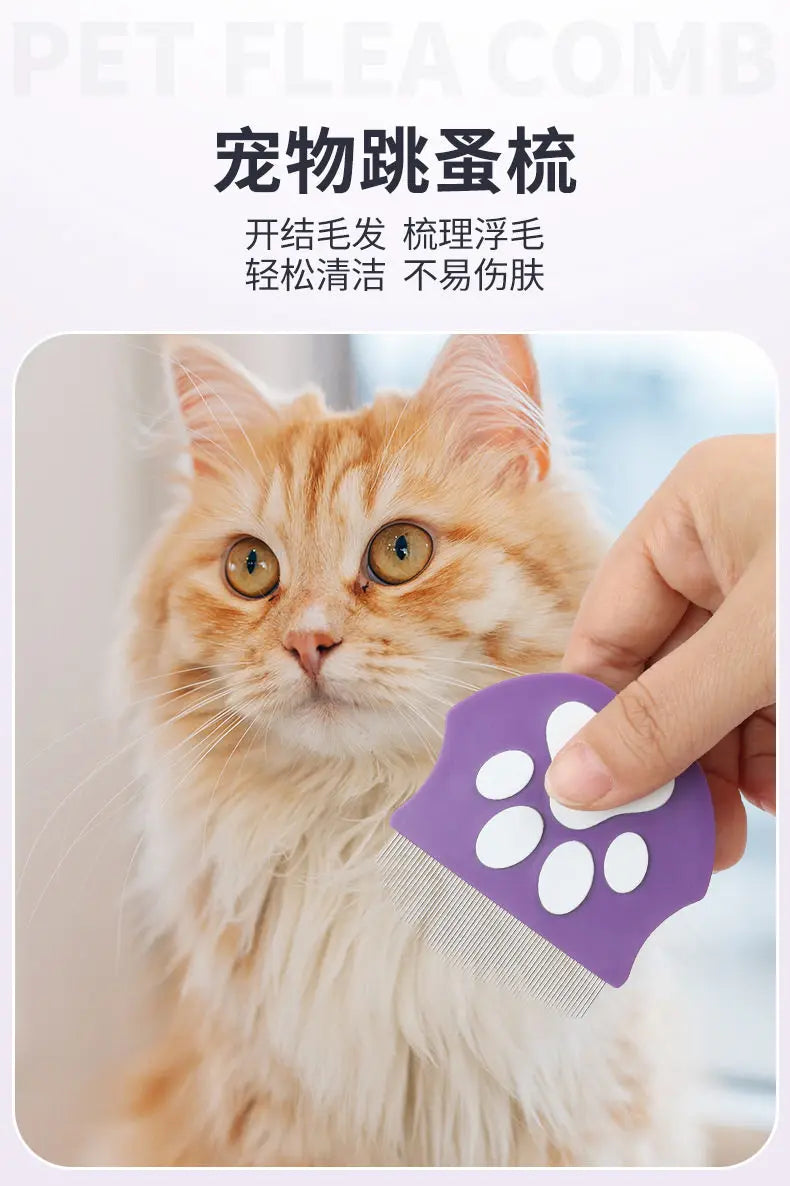 A hand is using a purple grooming comb on an orange tabby cat.