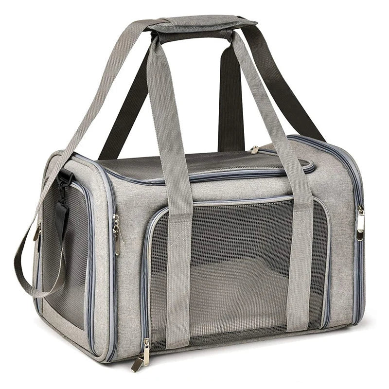 A gray portable pet carrier bag with padded straps and a mesh window is shown.