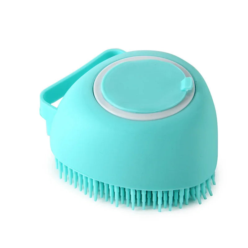 A light blue silicone pet bathing massage glove with a handle and bristles.