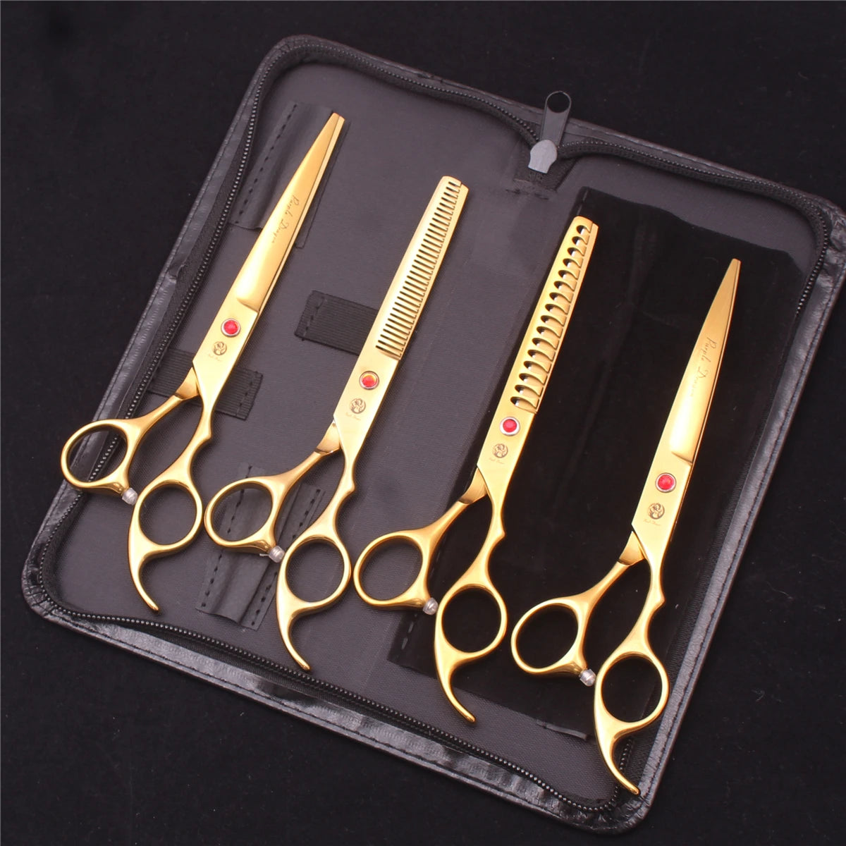 A set of professional stainless steel pet grooming scissors displayed in a black zippered pouch.