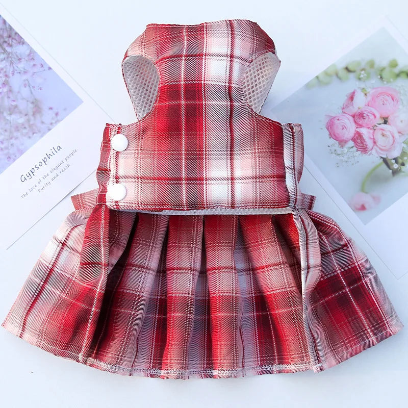A red plaid pet dress-up harness and matching clothes for a dog displayed on a white background.