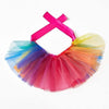 A colorful tulle tutu dress for a small dog with a pink ribbon bow.