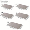 A set of Kemorela reusable pet training pads in various sizes XS, S, M, L, and XL.