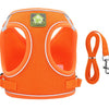 Orange mesh dog harness with reflective strips and a carabiner clip