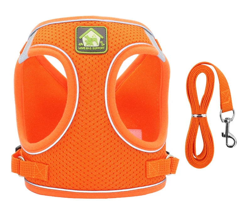 Orange mesh dog harness with reflective strips and a carabiner clip