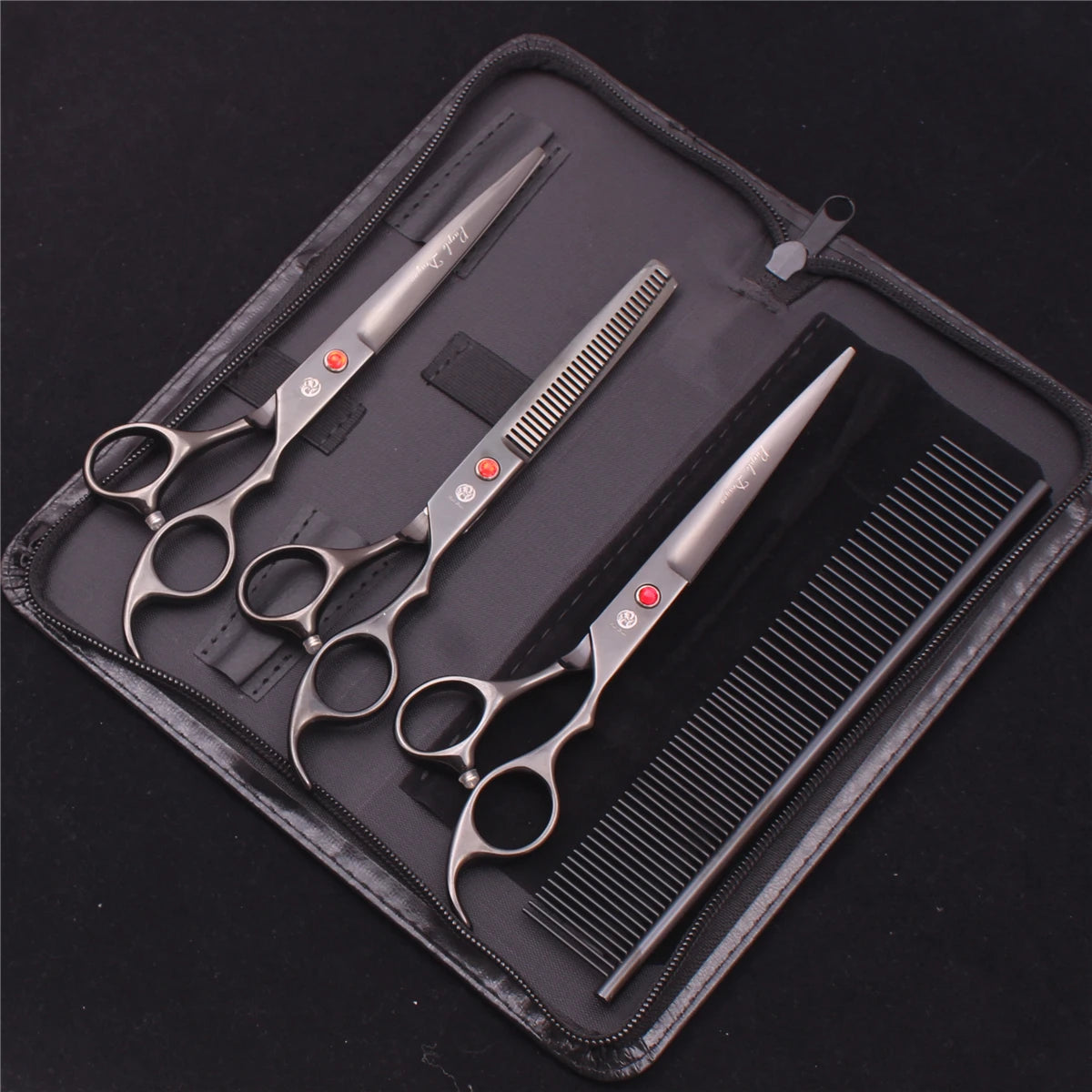 A black zippered case containing a professional stainless steel pet grooming scissors set including various grooming tools.