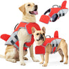 A light-colored dog wearing a red waterproof swimming life jacket with reflective accents.