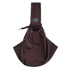 A dark brown pet carrier sling bag designed for dogs and cats.