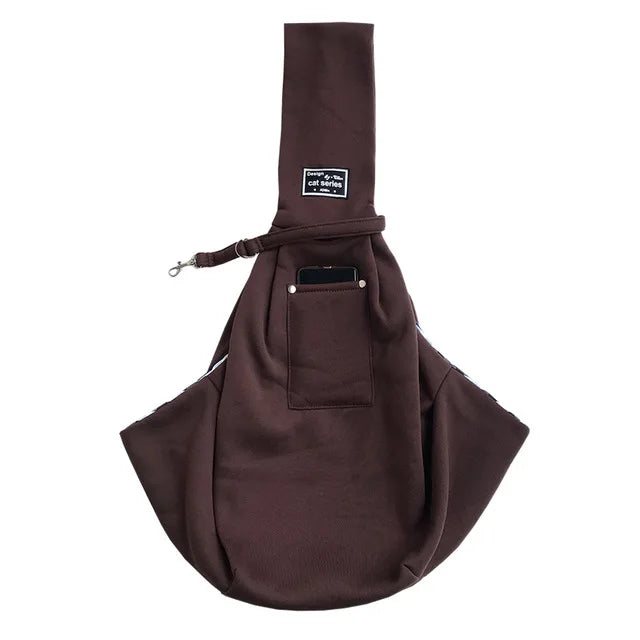 A dark brown pet carrier sling bag designed for dogs and cats.