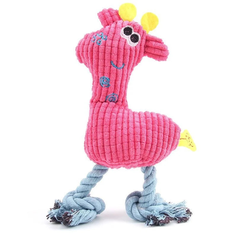 A pink plush toy shaped like a giraffe with yellow accents and blue braided rope legs.