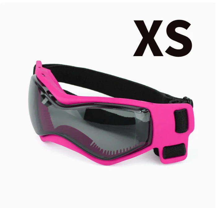 A bright pink pet safety helmet and goggles set for dogs and cats.