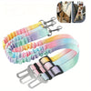 Colorful adjustable dog car seat belt with elastic bungee buffer shown with a dog.