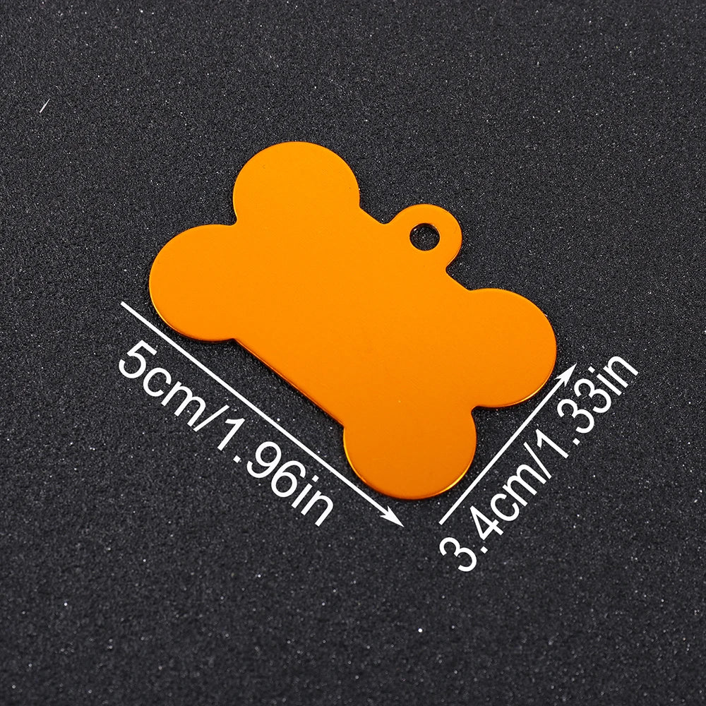 An orange bone-shaped dog ID tag is shown against a dark background with dimension markings.