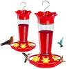 Comedero para colibríes rojo suspendido con tubo transparente y base de flor amarilla.