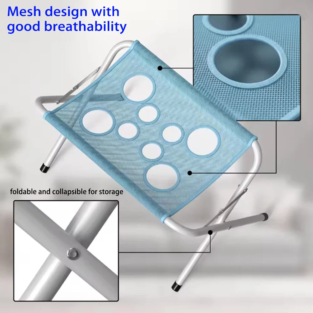 A light blue mesh pet grooming hammock with multiple holes, shown folded and a stand mechanism.