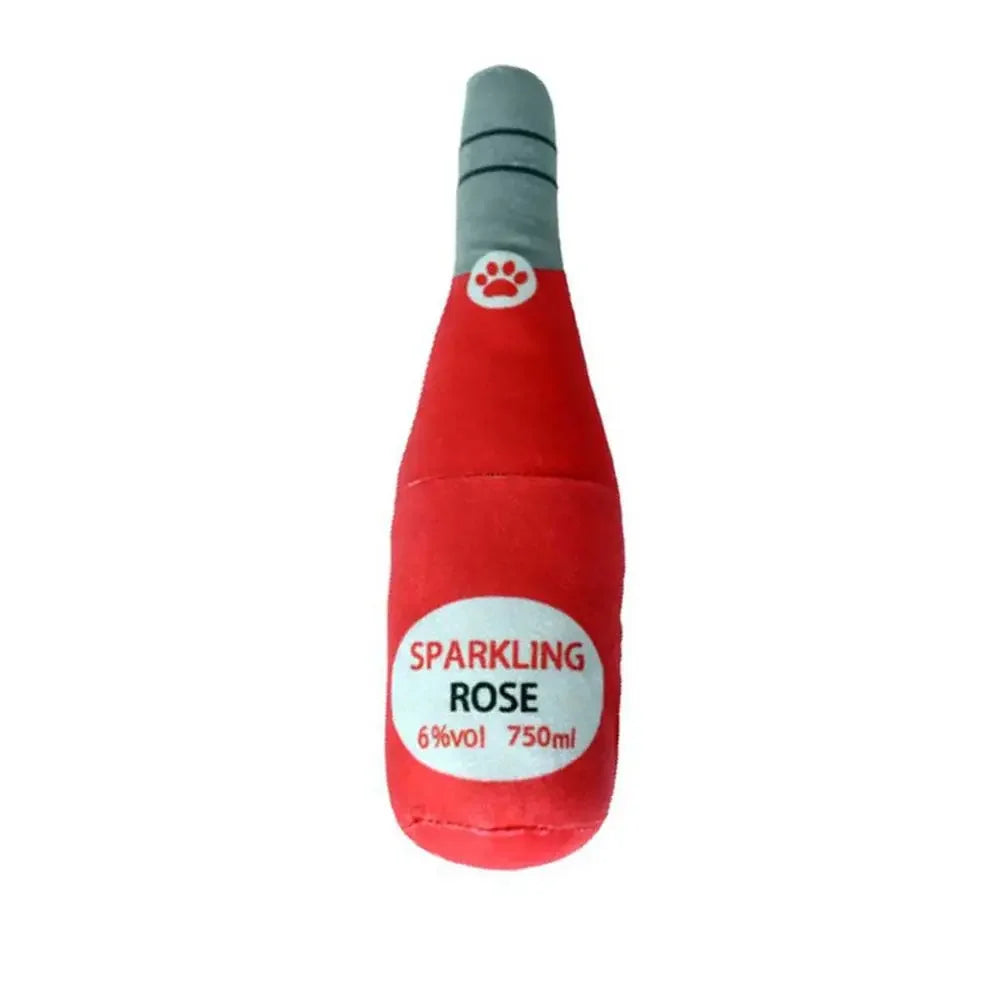 A red bottle-shaped squeaky plush dog toy with a gray tip and a paw print detail.