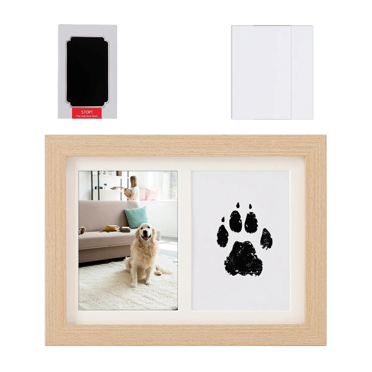 A wooden frame displaying a black pet paw print silhouette on white paper, with a white door and a red stop sign nearby.
