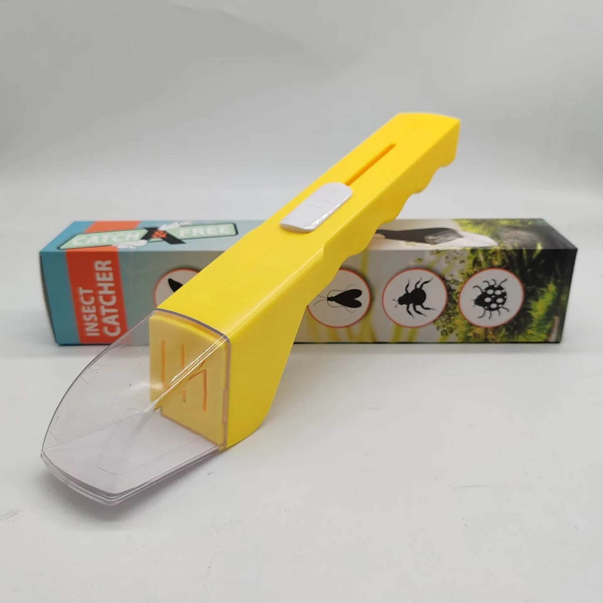A yellow portable handheld insect catcher with a white trigger is displayed next to its packaging box.